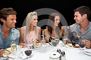 Two young couples in restaurant