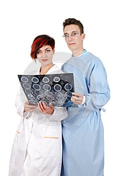 Two young doctor looking at tomography result.