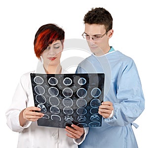 Two young doctor looking at tomography result.