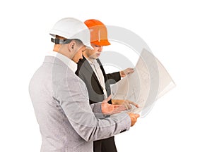 Two young engineers discussing a building plan