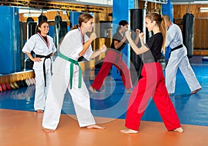 Two young female fighters sparring during mugendo training
