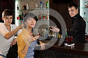 Two young friends relaxing in a pub