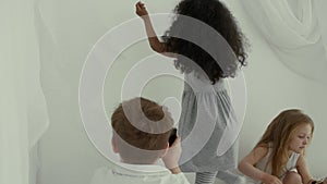 Two young girl at home playing with shadows