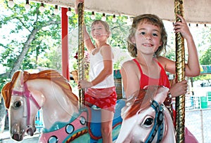 Two young girls on Carousel