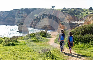 Two young girls exploring Portuguese coastline