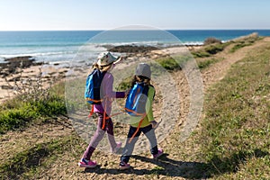 Two young girls exploring Spanish coastline photo