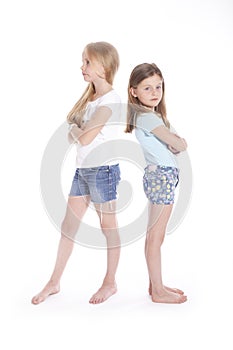 Two young girls having a disagreement