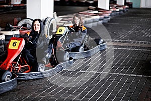 Two Young girls karting racers