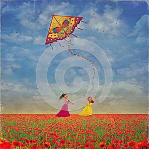 Two young girls with the kite on the field of poppies