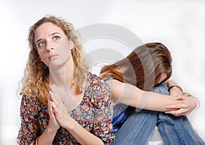 Two young girls in praying for help