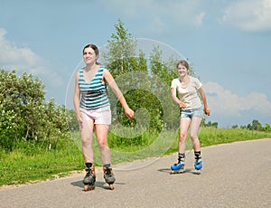 Two Young girls on roller blades