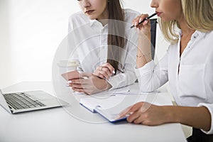 Two young girls at a table