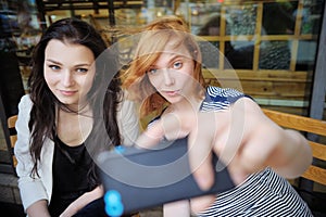 Two young girls taking a self portrait