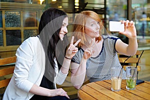 Two young girls taking selfie