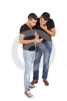 Two young guys look at cell phone