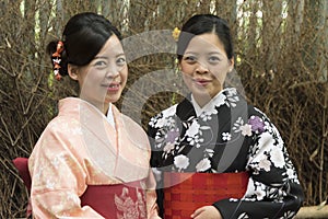 Two young japanese women posing in kimono