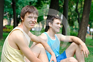 Two young man resting at the park