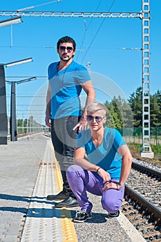 Two young men standing on the platform