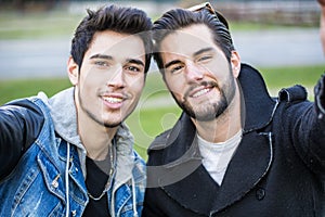 Two young men taking selfie