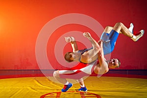 Two young men wrestling