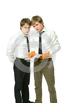 Two Young Office Workers Discuss A Document