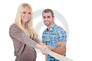 Two young people pulling rope