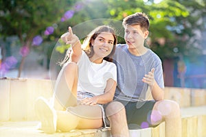 Two young people are sitting in the park