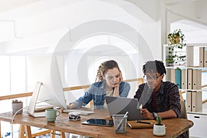 Two Young People Working in Modern Office