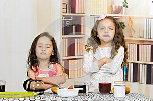 Two young preschooler girls refusing to eat