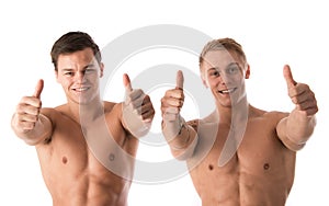 Two young smiling bodybuilder gesturing thumbs up
