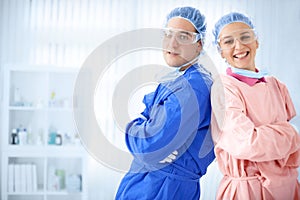 Two young surgeon standing in hospital room