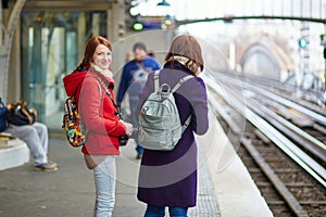 Two young tourist in Parisian subway