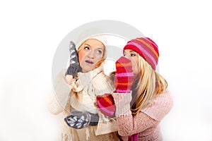 Two young winter girls friends in gloves