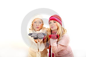 Two young winter woman in gloves and scarfs