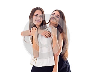 Two young woman embracing