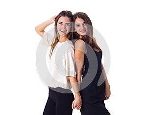 Two young woman holding hands