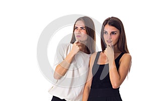 Two young woman looking on something