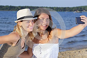 two young woman selfy in nature