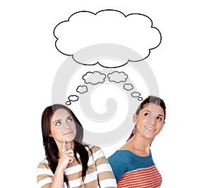 Two young woman thinking about the same idea