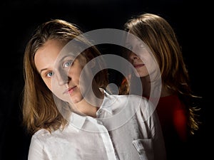 Two young women on a black background