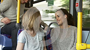 Two Young Women On Bus Journey Together