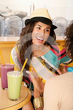 Two Young Women at a Cafe