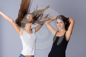 Two young women jumping