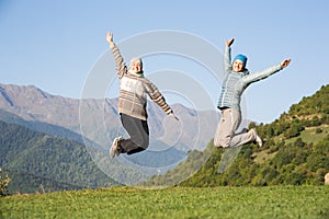 Two young women jumping