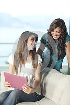 Two young women with laptop