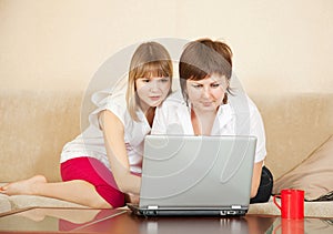 Two young women with laptop