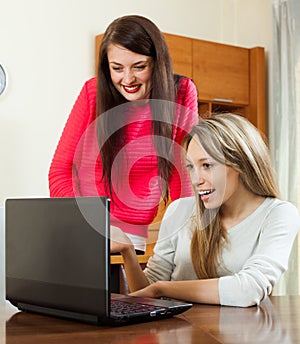 Two young women with laptop