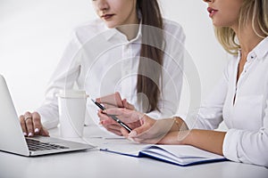 Two young women in office