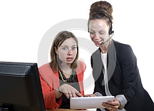 Two young women in office working