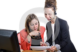 Two young women in office working